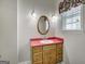 Cozy bathroom with vanity sink and decorative accents and natural lighting at 871 Clearwater Rd, Sharpsburg, GA 30277