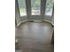 Bright living room area with large windows and modern, hard flooring at 871 Clearwater Rd, Sharpsburg, GA 30277