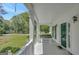 Relax on the porch swing with views of the manicured lawn and serene neighborhood at 871 Clearwater Rd, Sharpsburg, GA 30277