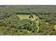 Beautiful aerial view of a home surrounded by lush trees and greenery, offering a peaceful and private retreat at 1828 Pitts Chapel Rd, Newborn, GA 30056