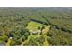 Expansive aerial view of estate with pool and plenty of surrounding woods at 1828 Pitts Chapel Rd, Newborn, GA 30056