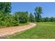 Scenic driveway surrounded by trees and greenery leading into the property at 1828 Pitts Chapel Rd, Newborn, GA 30056