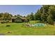 Charming home with a pool, surrounded by lush greenery and a spacious yard, perfect for outdoor living at 1828 Pitts Chapel Rd, Newborn, GA 30056