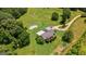 Aerial view of home with swimming pool and large manicured lawn at 1828 Pitts Chapel Rd, Newborn, GA 30056