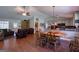 Open living space with hardwood floors features a dining area, living room, and modern kitchen at 1828 Pitts Chapel Rd, Newborn, GA 30056