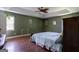 Spacious main bedroom with hardwood floors, tray ceiling, and a walk-in closet at 1828 Pitts Chapel Rd, Newborn, GA 30056