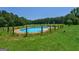 Enjoy a private pool surrounded by lush greenery, ideal for relaxation and outdoor fun at 1828 Pitts Chapel Rd, Newborn, GA 30056