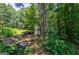 Outside view of this property with plenty of wooded area, storage and space to build at 1828 Pitts Chapel Rd, Newborn, GA 30056