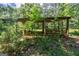 View of the wooded area and structure on the property, offering many possibilities! at 1828 Pitts Chapel Rd, Newborn, GA 30056