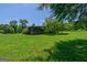 A lush green yard features mature trees and a serene setting for a relaxing lifestyle at 1828 Pitts Chapel Rd, Newborn, GA 30056
