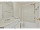 Bathroom with a vanity sink and a shower over bath with white fixtures at 1202 Loxley Cir, Peachtree City, GA 30269