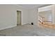 Carpeted bedroom with large trim and a hallway at 1202 Loxley Cir, Peachtree City, GA 30269