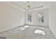 Carpeted bedroom with natural light from two windows at 1202 Loxley Cir, Peachtree City, GA 30269