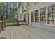 Spacious wooden deck offers views of the well-maintained backyard and large windows at 1202 Loxley Cir, Peachtree City, GA 30269