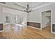 Spacious dining room with hardwood floors, windows, and access to other rooms at 1202 Loxley Cir, Peachtree City, GA 30269