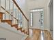 Open foyer with hardwood floors and a staircase leading to the second floor at 1202 Loxley Cir, Peachtree City, GA 30269