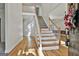 Bright foyer features hardwood floors, staircase, and ample natural light at 1202 Loxley Cir, Peachtree City, GA 30269