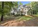 Charming home with a well-maintained lawn and mature trees providing shade and privacy at 1202 Loxley Cir, Peachtree City, GA 30269