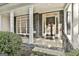 Covered front porch with stone accents, decorative wreath, and ample natural light at 1202 Loxley Cir, Peachtree City, GA 30269