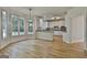 Open kitchen and dining area with hardwood floors and lots of natural light at 1202 Loxley Cir, Peachtree City, GA 30269