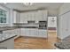 Kitchen featuring granite counters, stainless appliances, and ample cabinetry at 1202 Loxley Cir, Peachtree City, GA 30269