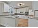 Well-lit kitchen with granite countertops, stainless appliances, and ample cabinet space at 1202 Loxley Cir, Peachtree City, GA 30269