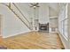 Bright living room showcases a stone fireplace, built-in shelves, and hardwood floors at 1202 Loxley Cir, Peachtree City, GA 30269