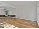 Open living room with beautiful hardwood floors, crown molding, and stylish chandelier at 1202 Loxley Cir, Peachtree City, GA 30269