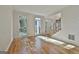 Sun-filled living room featuring hardwood floors and three large windows at 1202 Loxley Cir, Peachtree City, GA 30269