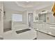 Bright main bathroom with double vanities, soaking tub, and tiled walk-in shower at 1202 Loxley Cir, Peachtree City, GA 30269