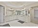 Bright main bathroom features dual vanities, large mirrors, and a walk-in shower at 1202 Loxley Cir, Peachtree City, GA 30269