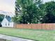 The backyard features a wood fence and large trees at 486 Village Cir, Stockbridge, GA 30281