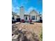 Relaxing backyard showcasing a patio seating area, stone pavers and lush surroundings at 486 Village Cir, Stockbridge, GA 30281