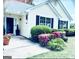 Inviting home exterior with lush landscaping and a walkway leading to the entrance at 486 Village Cir, Stockbridge, GA 30281