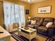 Relaxing living room with a comfortable sofa, coffee table, and natural light at 486 Village Cir, Stockbridge, GA 30281