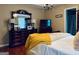 Spacious main bedroom featuring a large dresser and TV at 486 Village Cir, Stockbridge, GA 30281