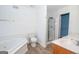 Bathroom features a tub, toilet, shower, and double sink with plenty of space at 611 Bernhard Rd, Fayetteville, GA 30215