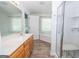 Bathroom offers wood-look floors, shower, jacuzzi tub and double sink at 611 Bernhard Rd, Fayetteville, GA 30215