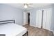 Spare bedroom with light gray walls, bi-fold closet doors, and wood-look floors at 611 Bernhard Rd, Fayetteville, GA 30215