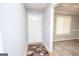 Inviting entryway with a decorative rug and view into the adjacent dining room at 611 Bernhard Rd, Fayetteville, GA 30215