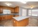 Spacious kitchen with granite countertops, wooden cabinets, and an island at 611 Bernhard Rd, Fayetteville, GA 30215