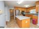 Spacious kitchen with granite countertops, wooden cabinets, and stainless steel appliances at 611 Bernhard Rd, Fayetteville, GA 30215