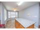 Spacious kitchen with granite countertops, wooden cabinets, and a breakfast nook at 611 Bernhard Rd, Fayetteville, GA 30215