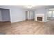 Spacious living area boasts a cozy fireplace, hardwood floors and lots of natural light at 611 Bernhard Rd, Fayetteville, GA 30215