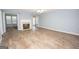 Bright living room featuring a fireplace and hardwood floors, perfect for relaxation at 611 Bernhard Rd, Fayetteville, GA 30215