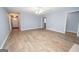 Open floor plan in living room with hardwood floors and neutral paint throughout at 611 Bernhard Rd, Fayetteville, GA 30215