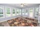 Light-filled sun room with wall-to-wall windows and outdoor access to the backyard at 611 Bernhard Rd, Fayetteville, GA 30215