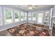 Cozy sun room featuring large windows and access to the back deck and backyard at 611 Bernhard Rd, Fayetteville, GA 30215