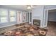 Charming sun room with fireplace, leading to the back deck through glass paneled doors at 611 Bernhard Rd, Fayetteville, GA 30215