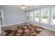 Bright and airy sun room features walls of windows and backyard views at 611 Bernhard Rd, Fayetteville, GA 30215